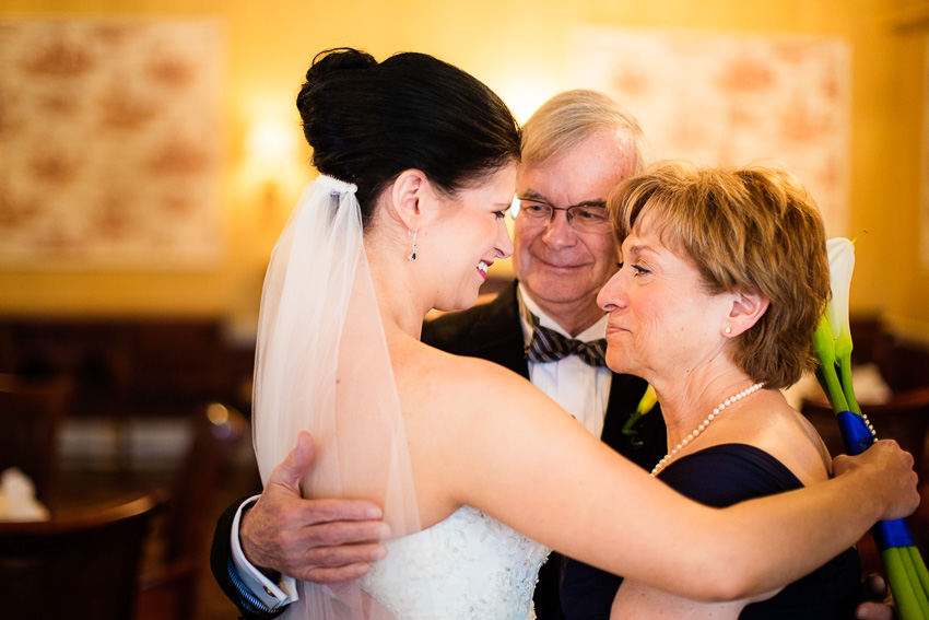 Bride with her parents before the wedding ceremony.