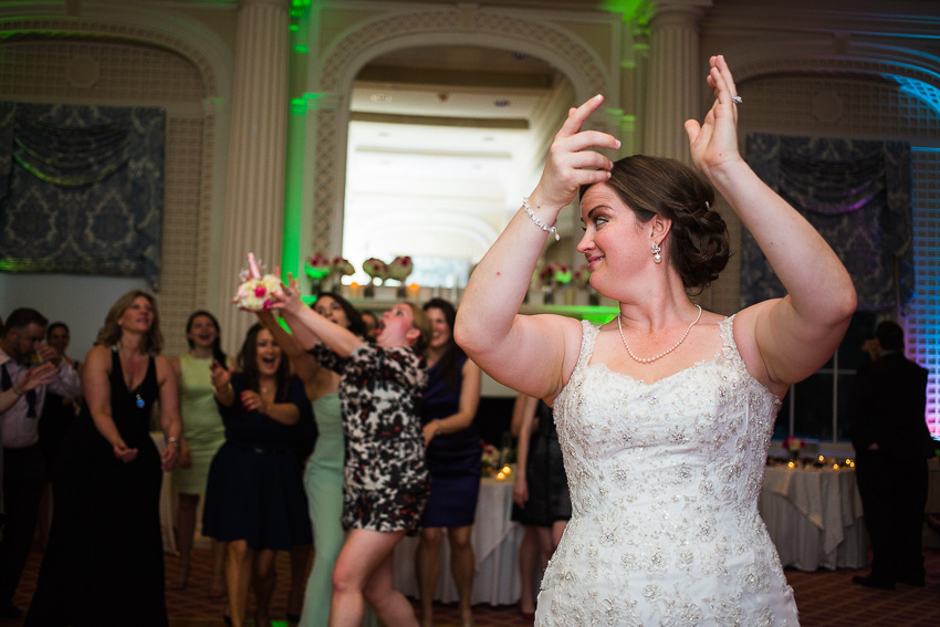 bouquet toss at Otesaga wedding reception