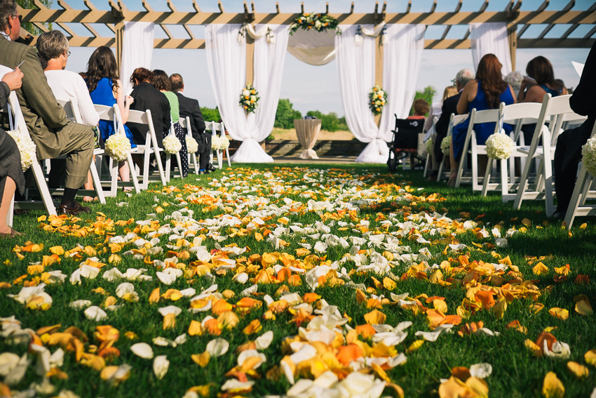 flowers in aisle at outdoor wedding at Turning Stone Casino