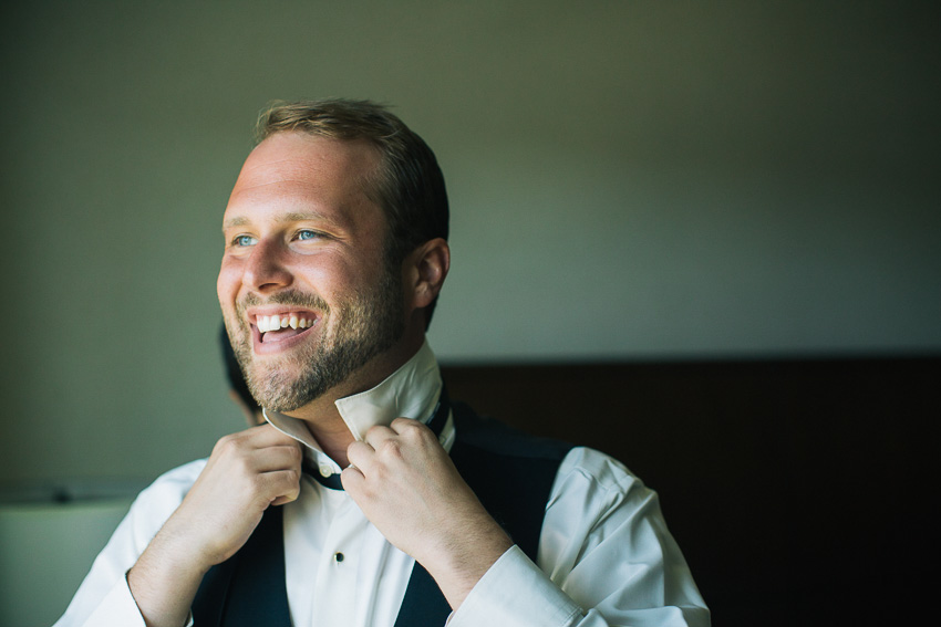 groom getting ready at Hilton Garden Inn Auburn