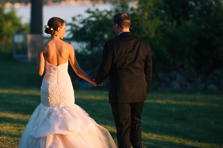 couple walking at sunset on Cayuga Lake