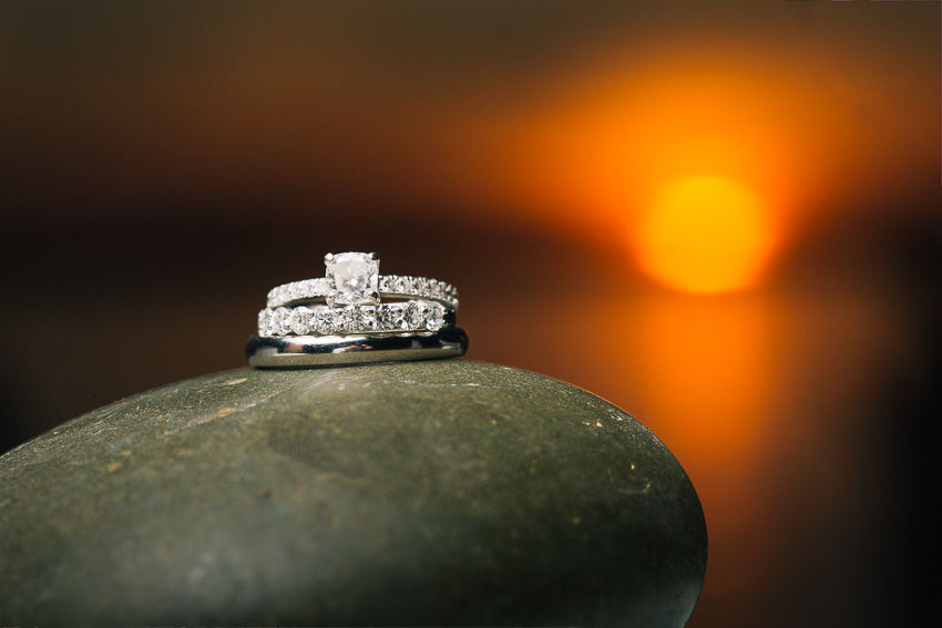 wedding rings at sunset