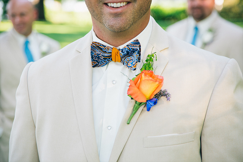 groom's orange and blue wedding details