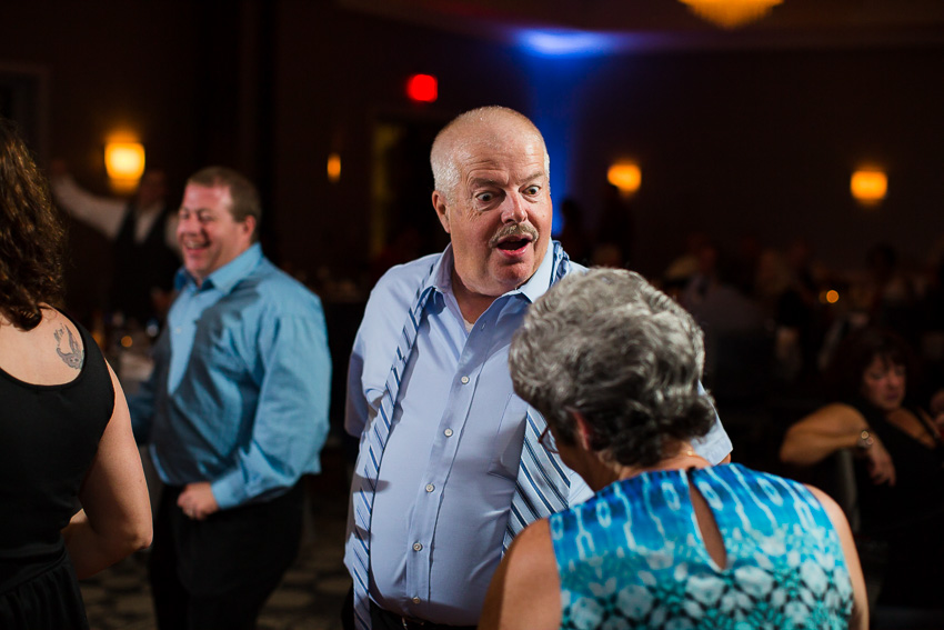 wedding guest having fun dancing at wedding reception