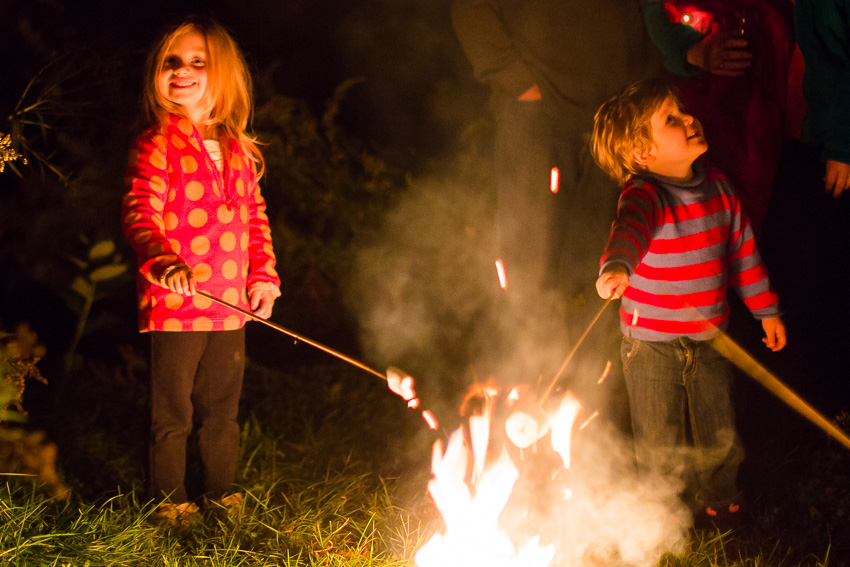 kids making smores at west branch resort wedding rehearsal