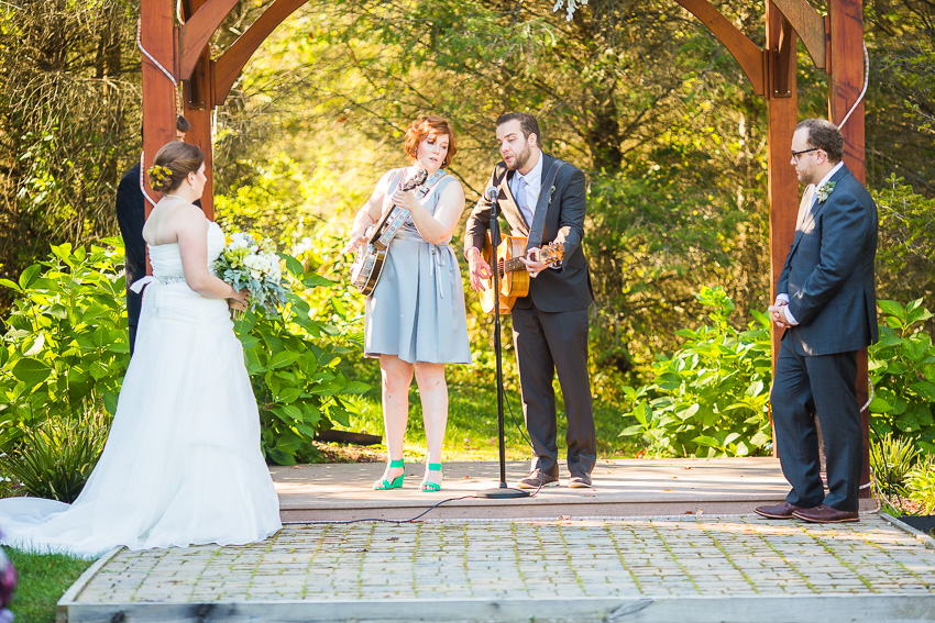 groom's siblings sing at west branch wedding 