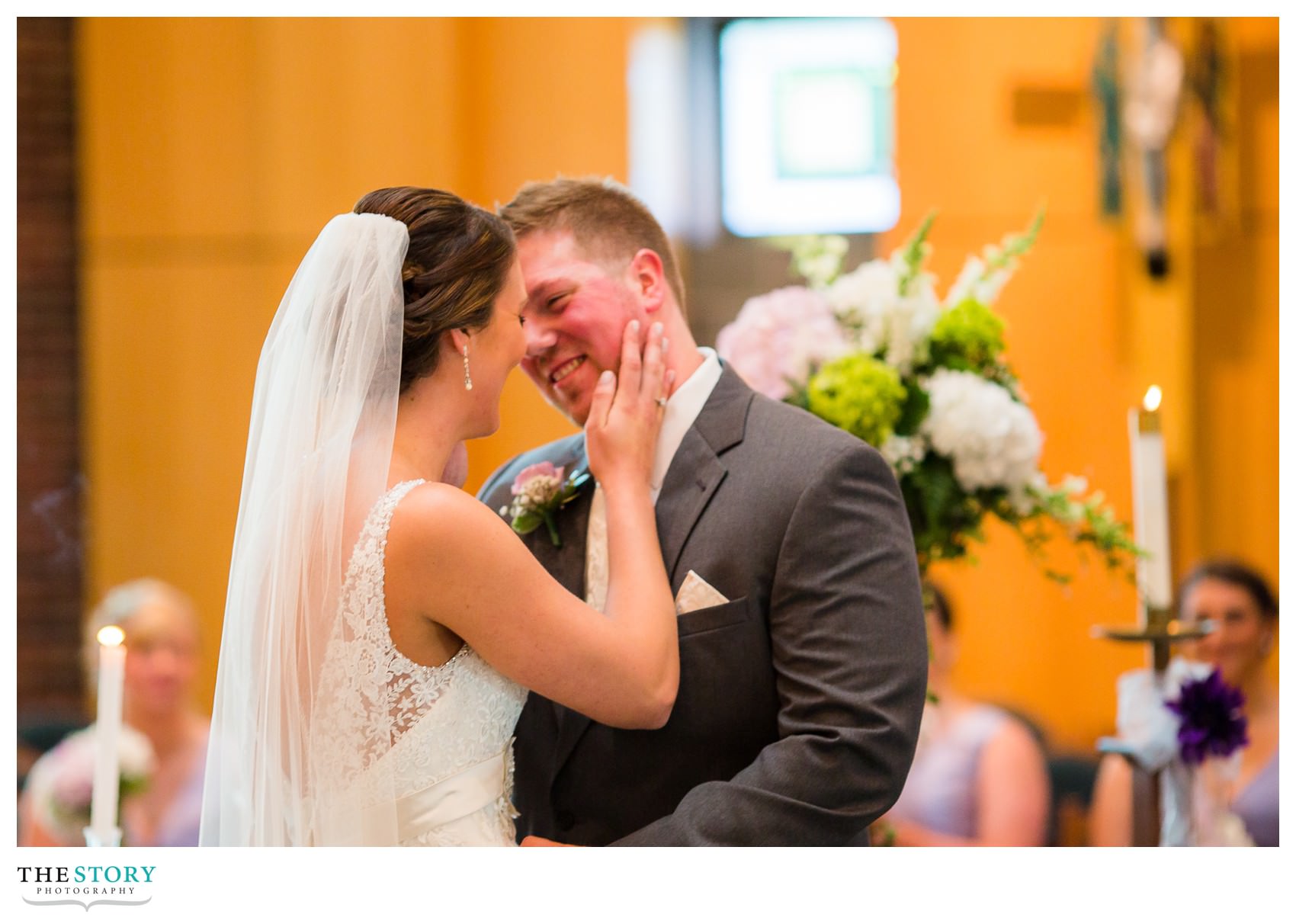 bride and groom's first kiss at LeMoyne wedding