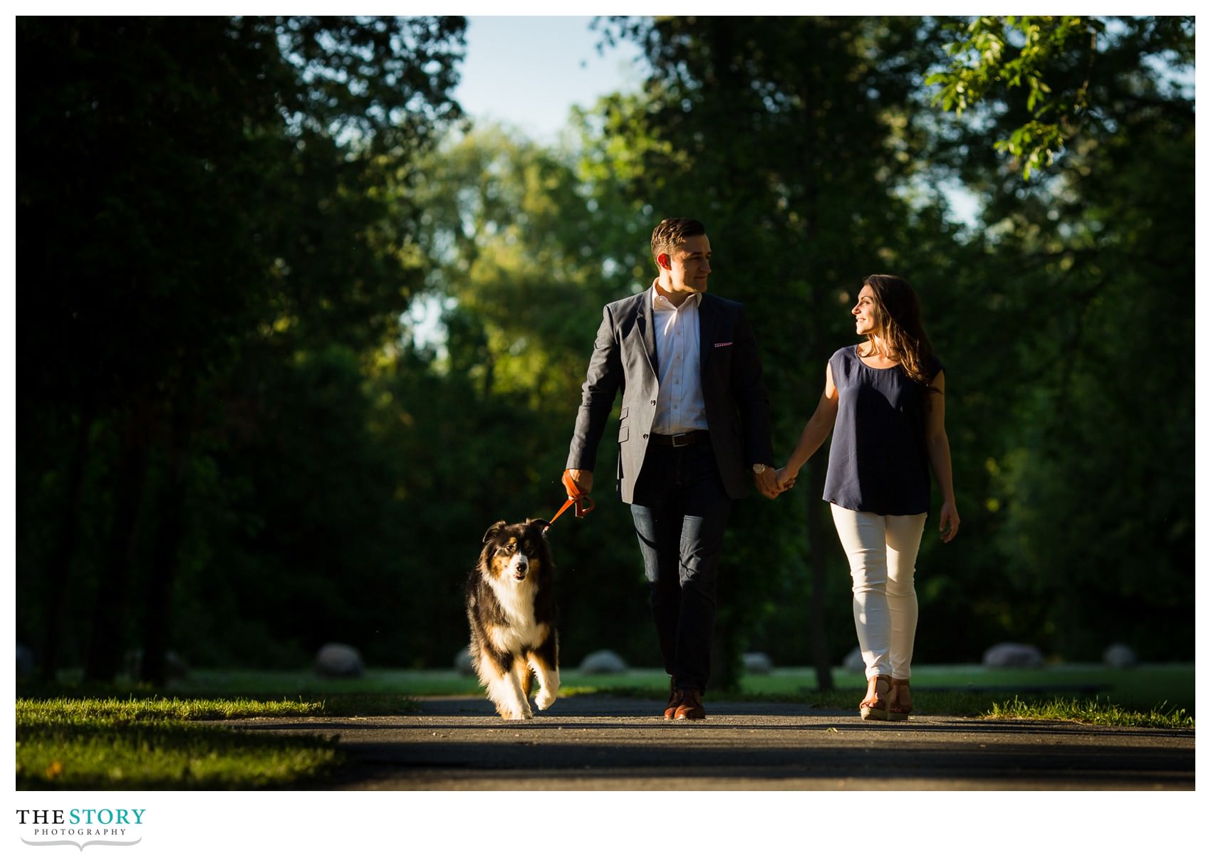 couple walking dog at green lakes