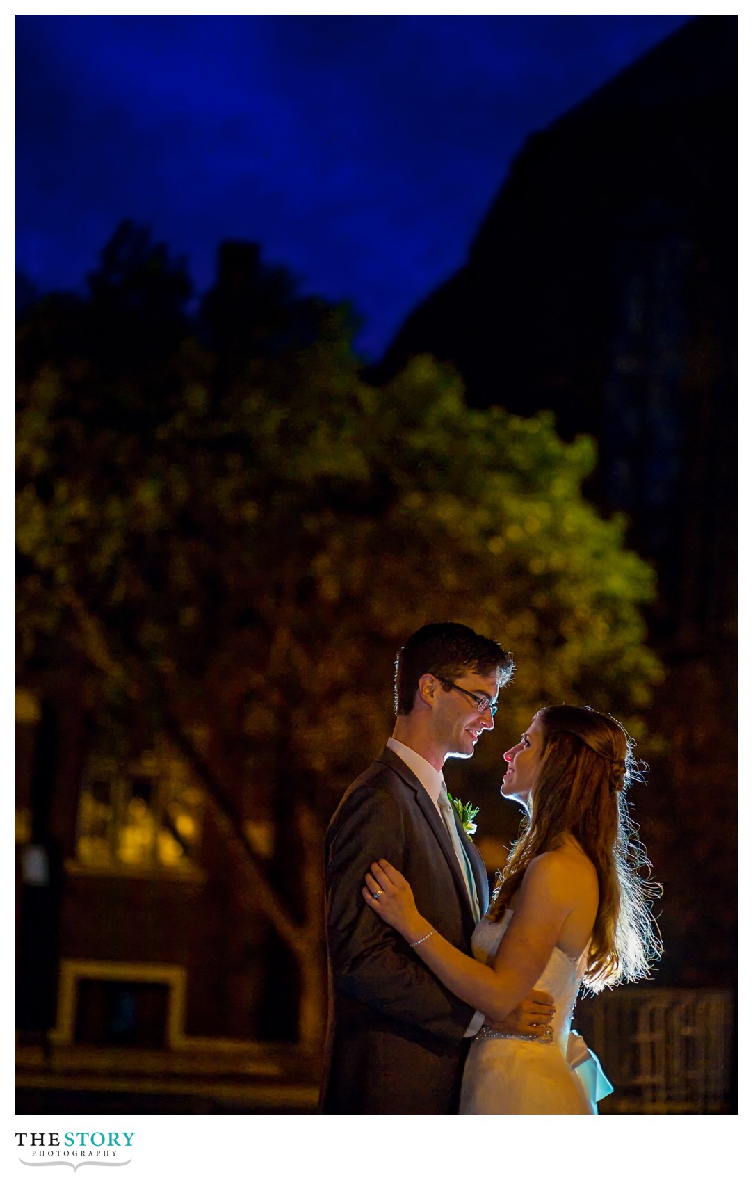 night wedding photo outside inn on broadway in Rochester