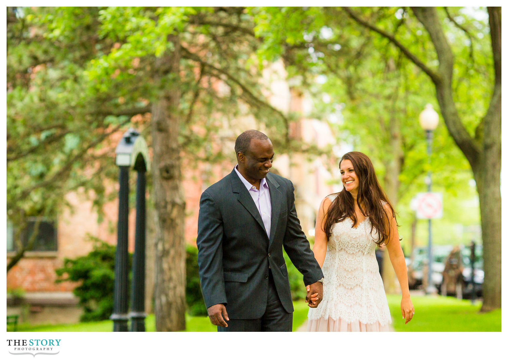 couple laughing during engagement photos in Skaneateles.