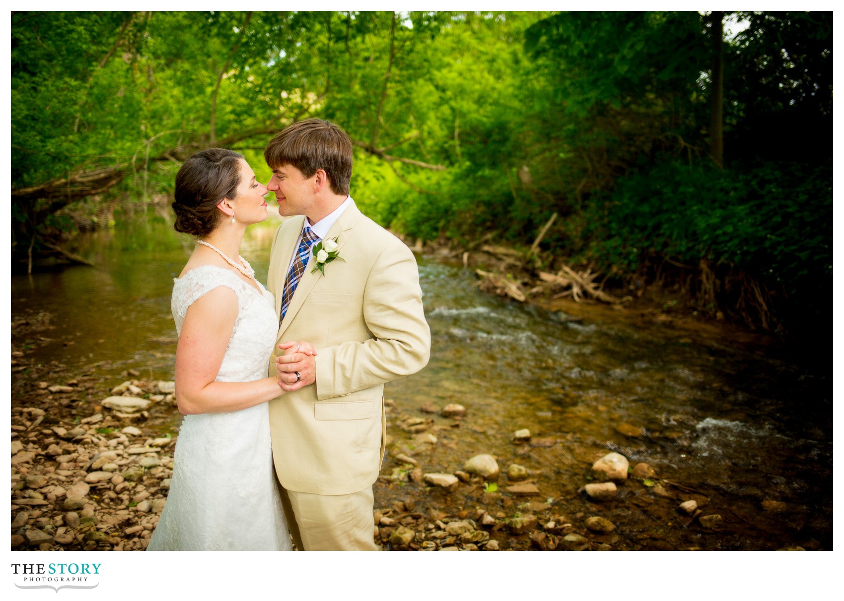 bride and groom photos by creek