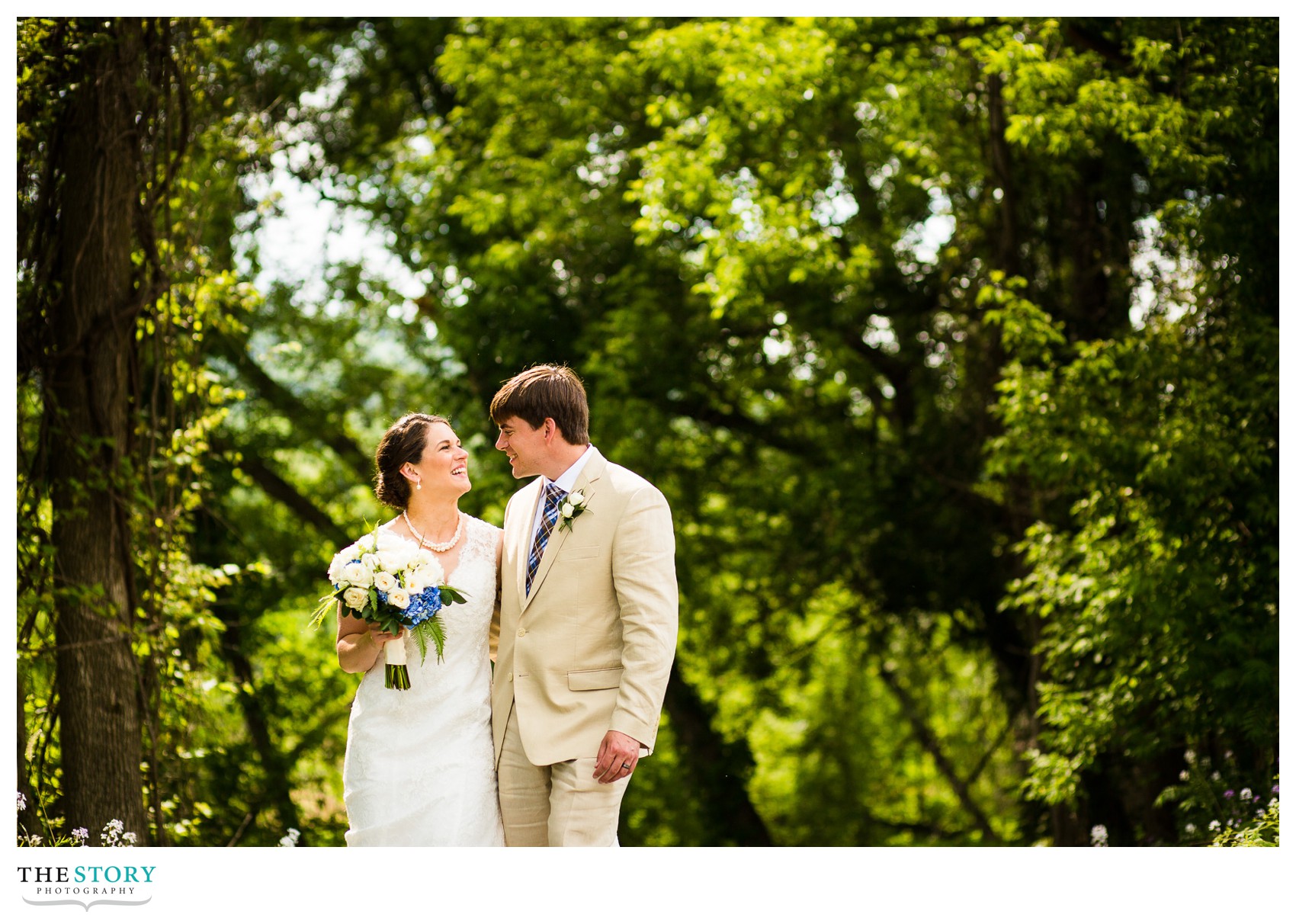 bride & groom walking to Wolf Oak Acres barn for reception