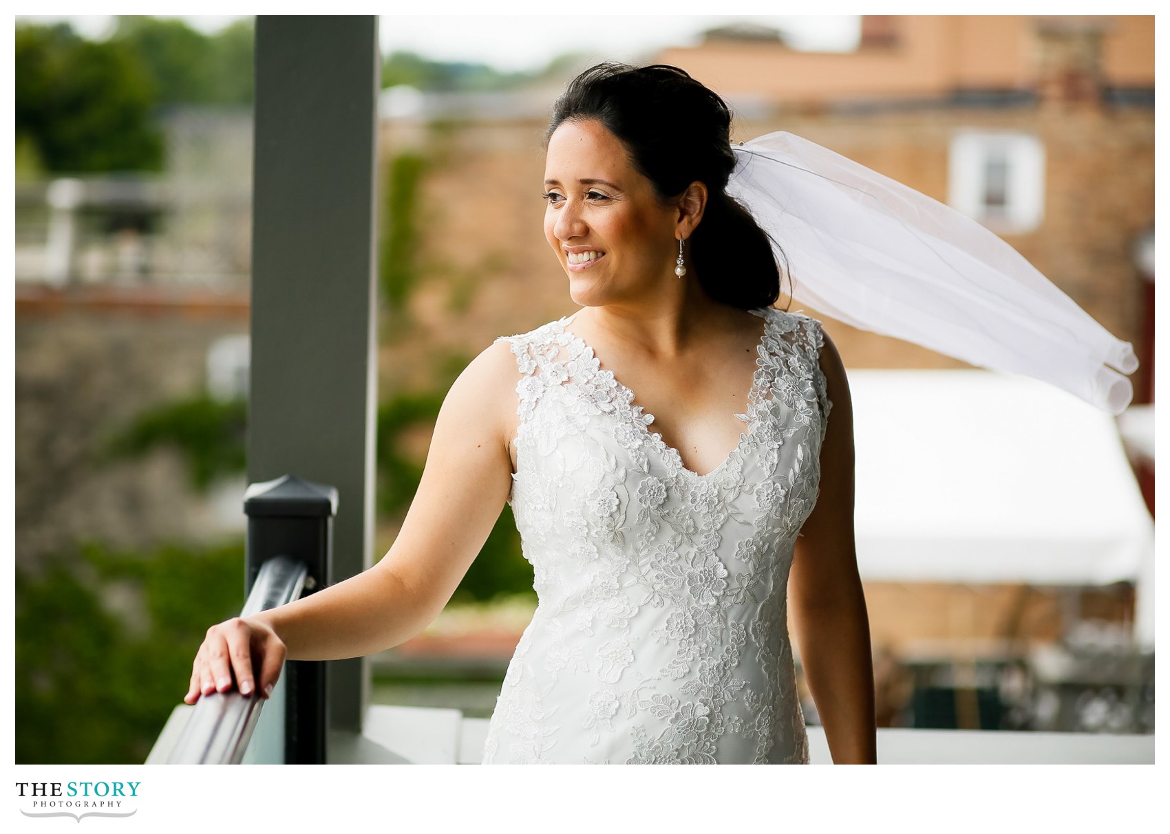 bride portrait on balcony over looking Skaneateles Lake at Loft 42