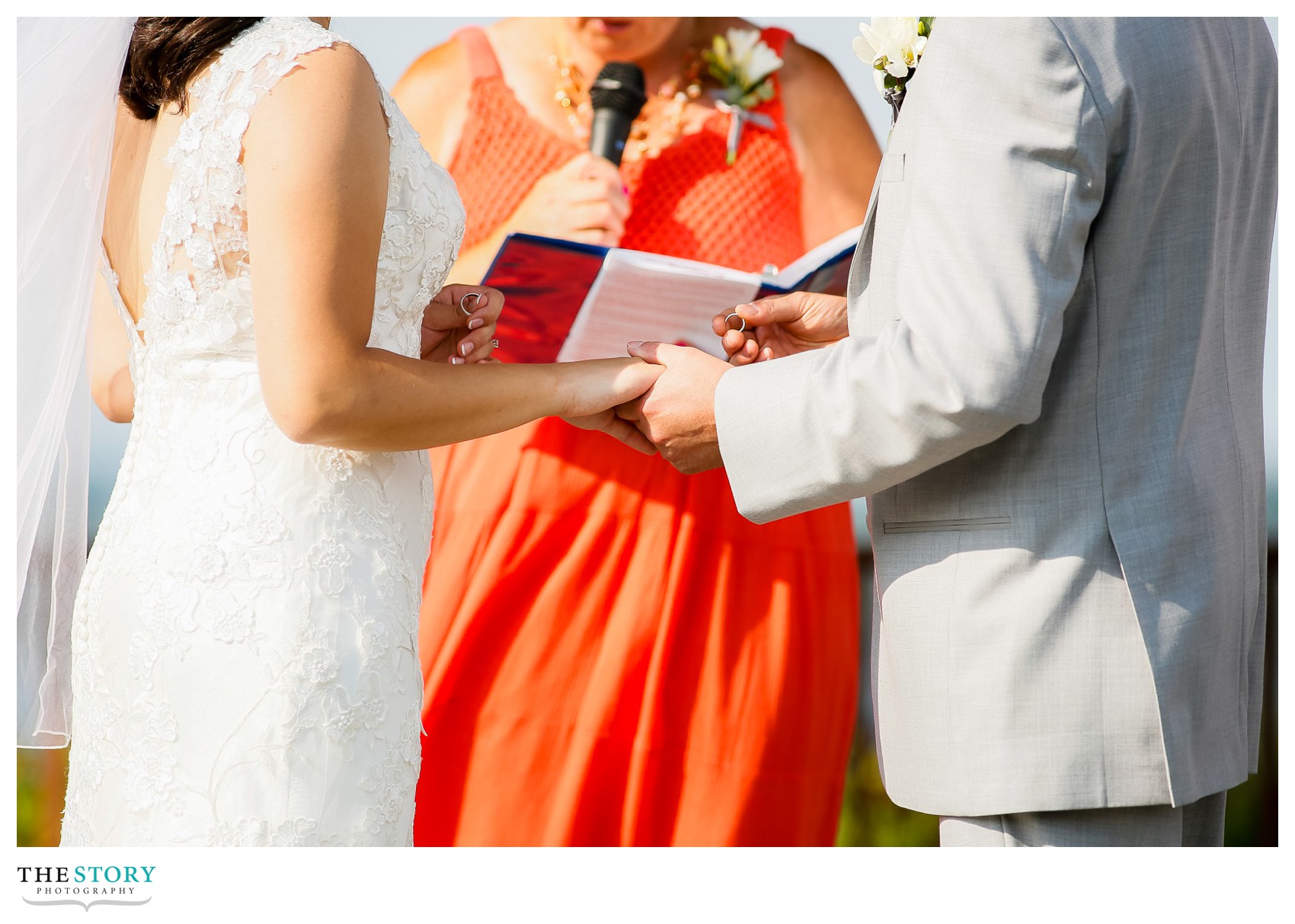 wedding ring exchange at outdoor ceremony in Skaneateles