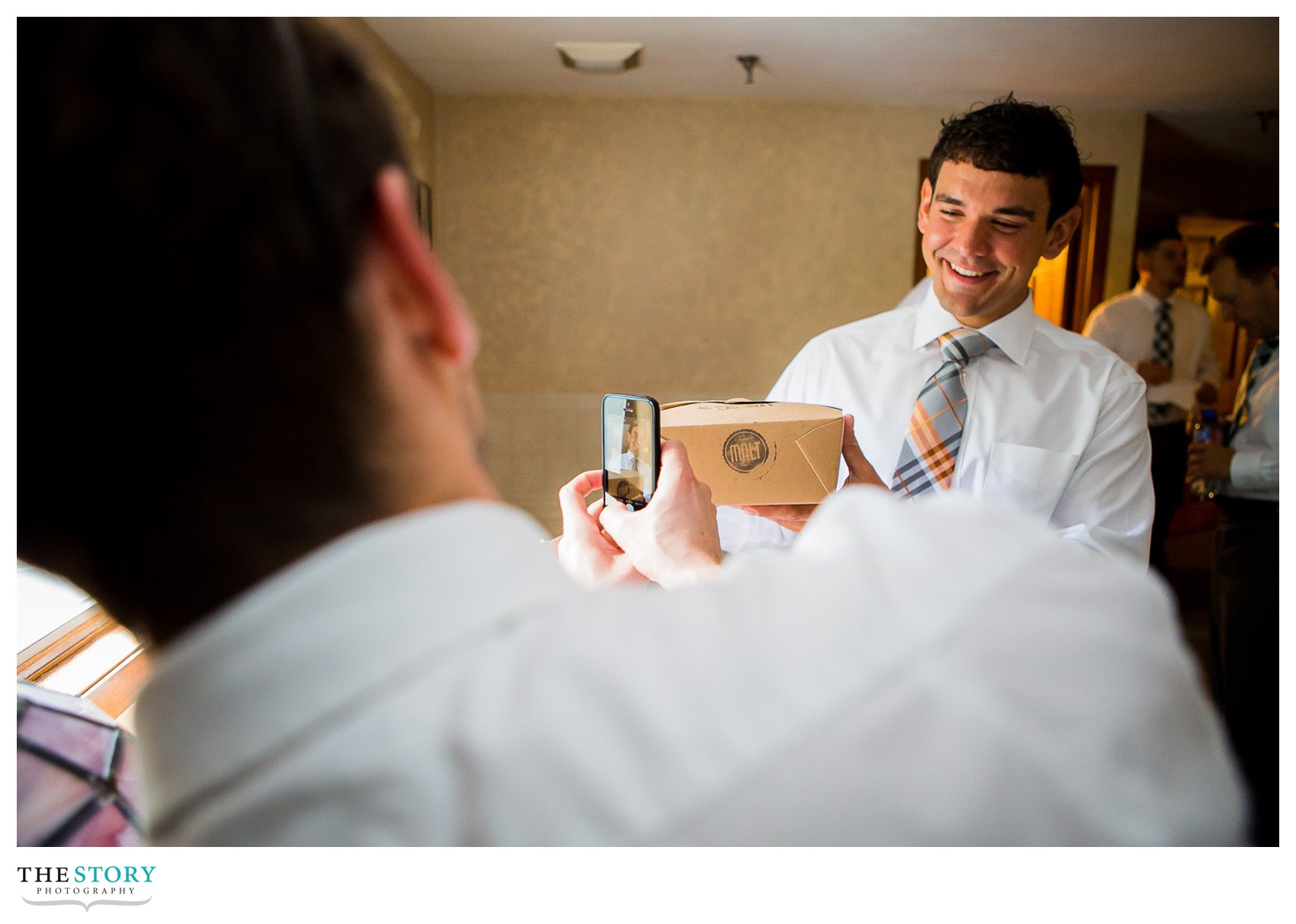 groom getting ready for wedding with modern malt breakfast