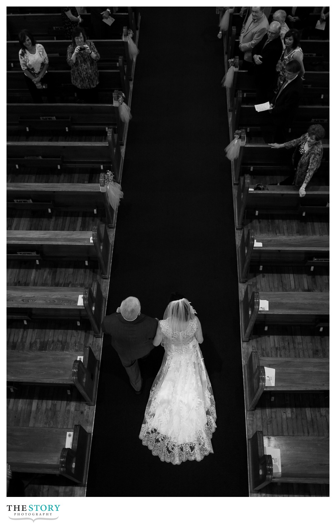 bride walking down aisle for wedding at st. matthew's in east syracuse 