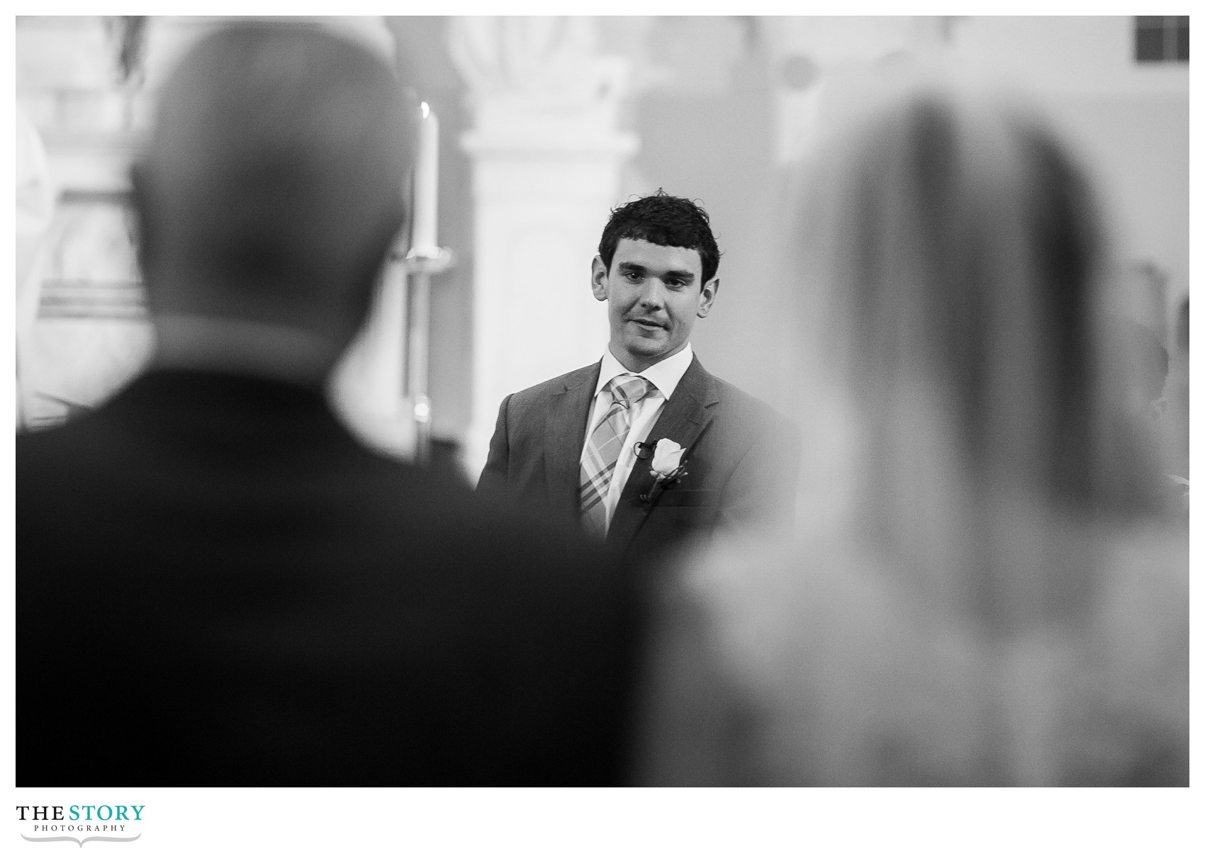 groom watching bride walk down aisle at st. matthew's wedding ceremony