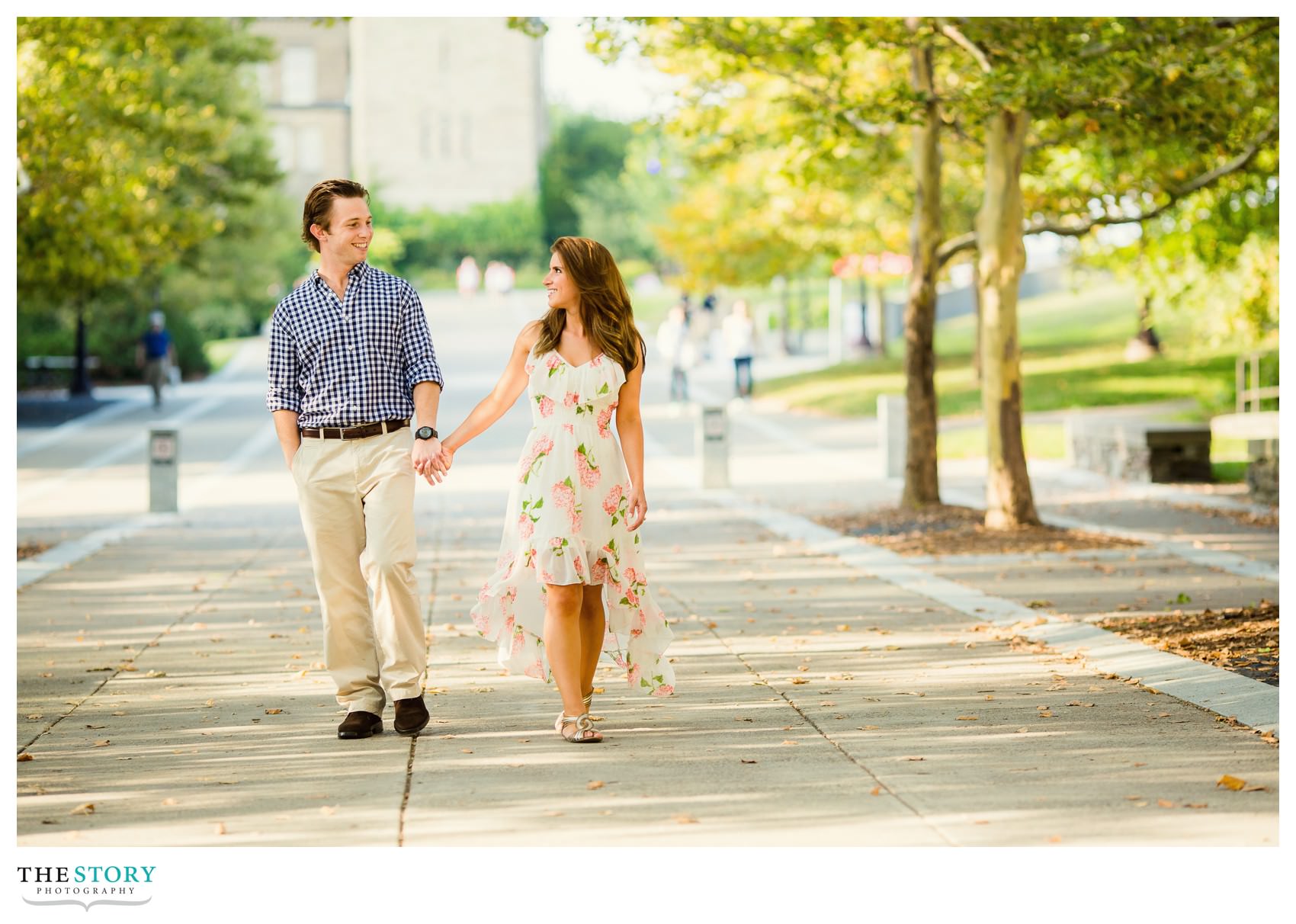 couple walking Ho Plaza at Cornell University for engagement photos