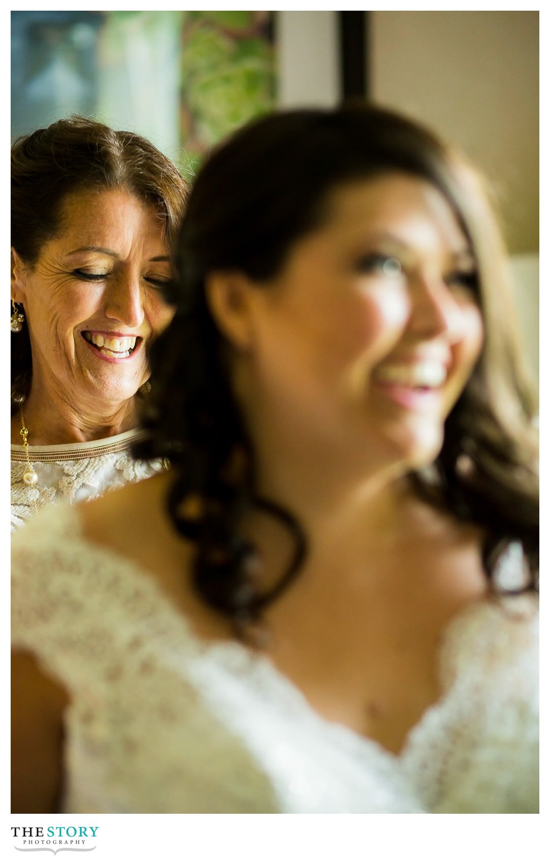 bride's mom helps with dress before Auburn, NY wedding