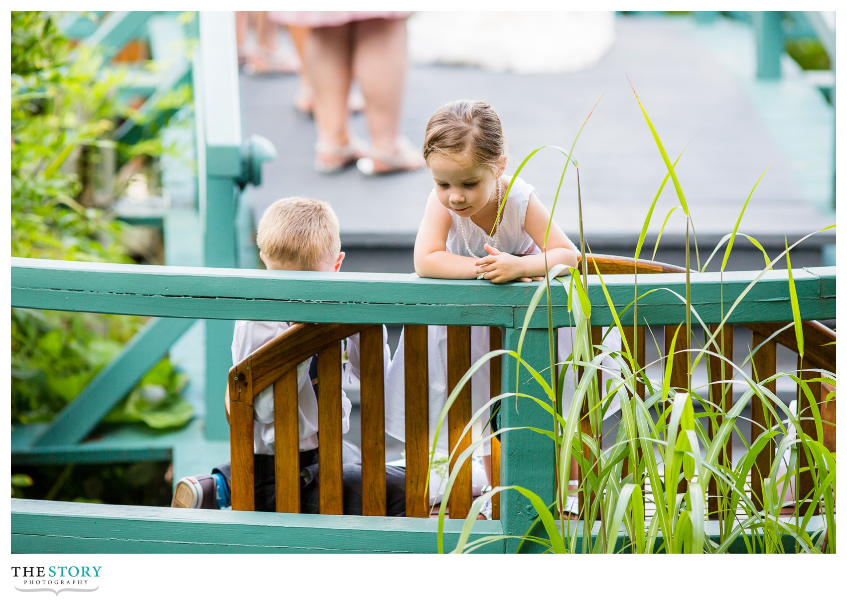 flower girl is distracted during Mirbeau wedding ceremony