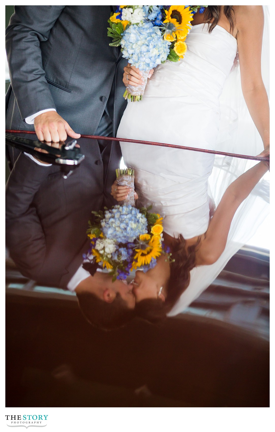wedding photo with antique boat on St. Lawrence River