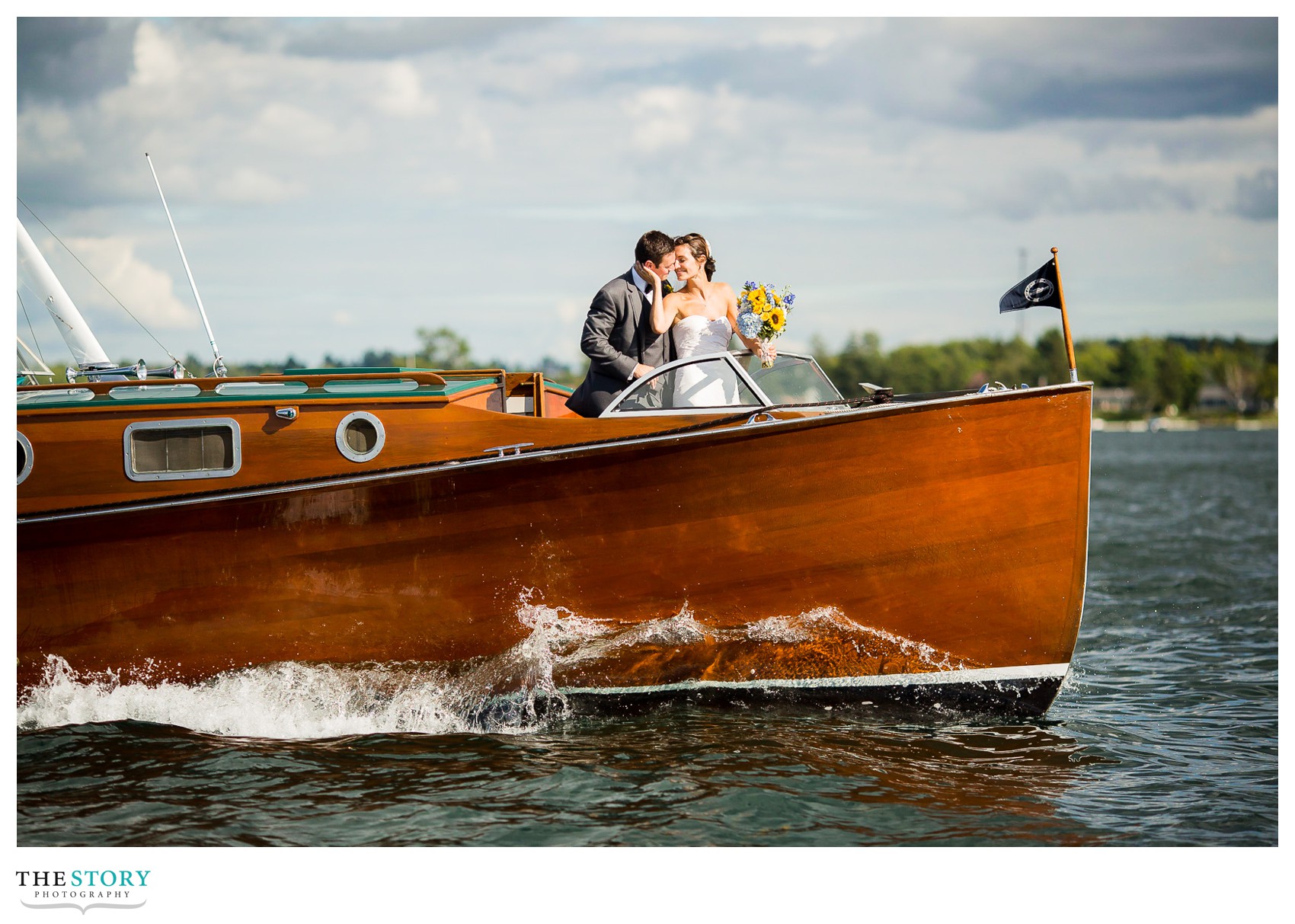 wedding photos with antique boat on St. Lawrence River