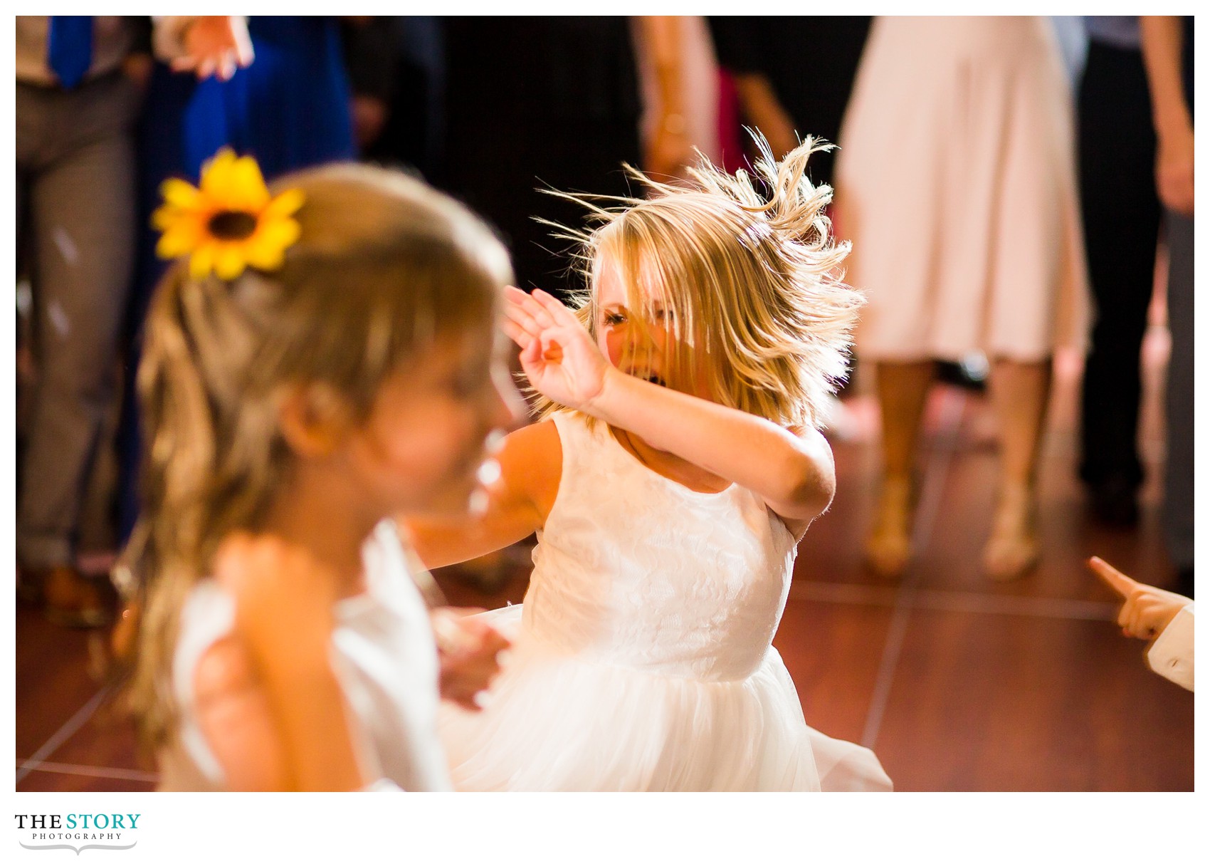 flower girls dance at wedding reception at 1000 Islands Harbor Hotel