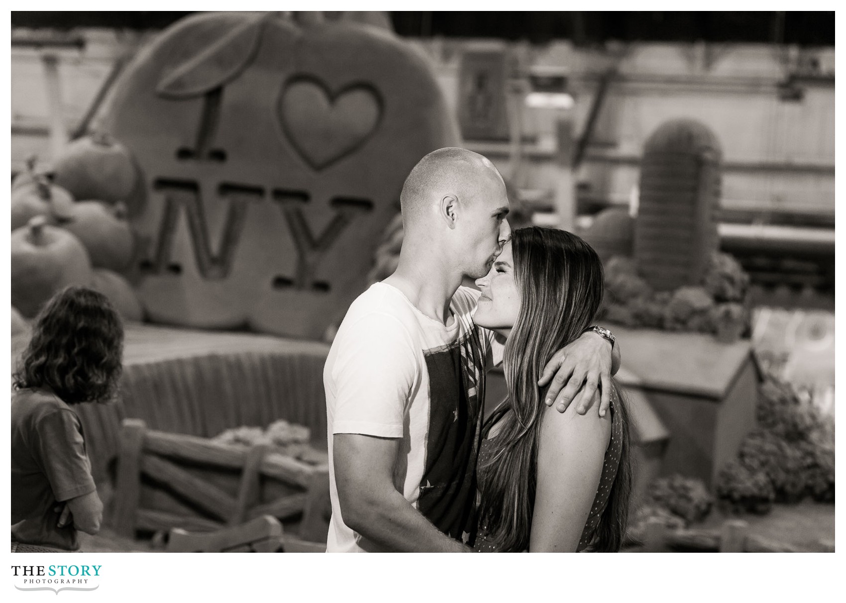 fun engagement photography at New York state fair with sand sculpture