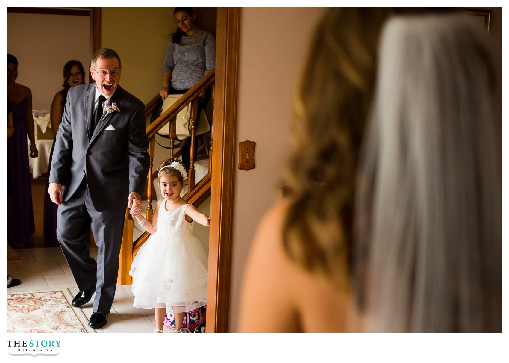 father of the bride sees her for the first time on the wedding day