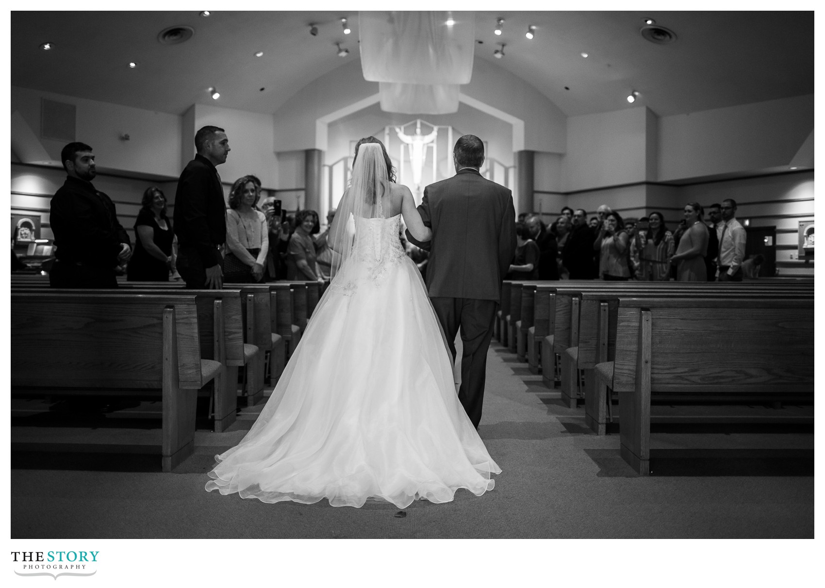 bride walking down the aisle for wedding ceremony at St. Ann's Church in Manlius