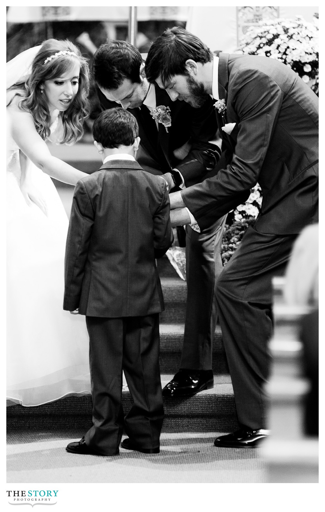 the ring bearer getting all the attention at the wedding ceremony