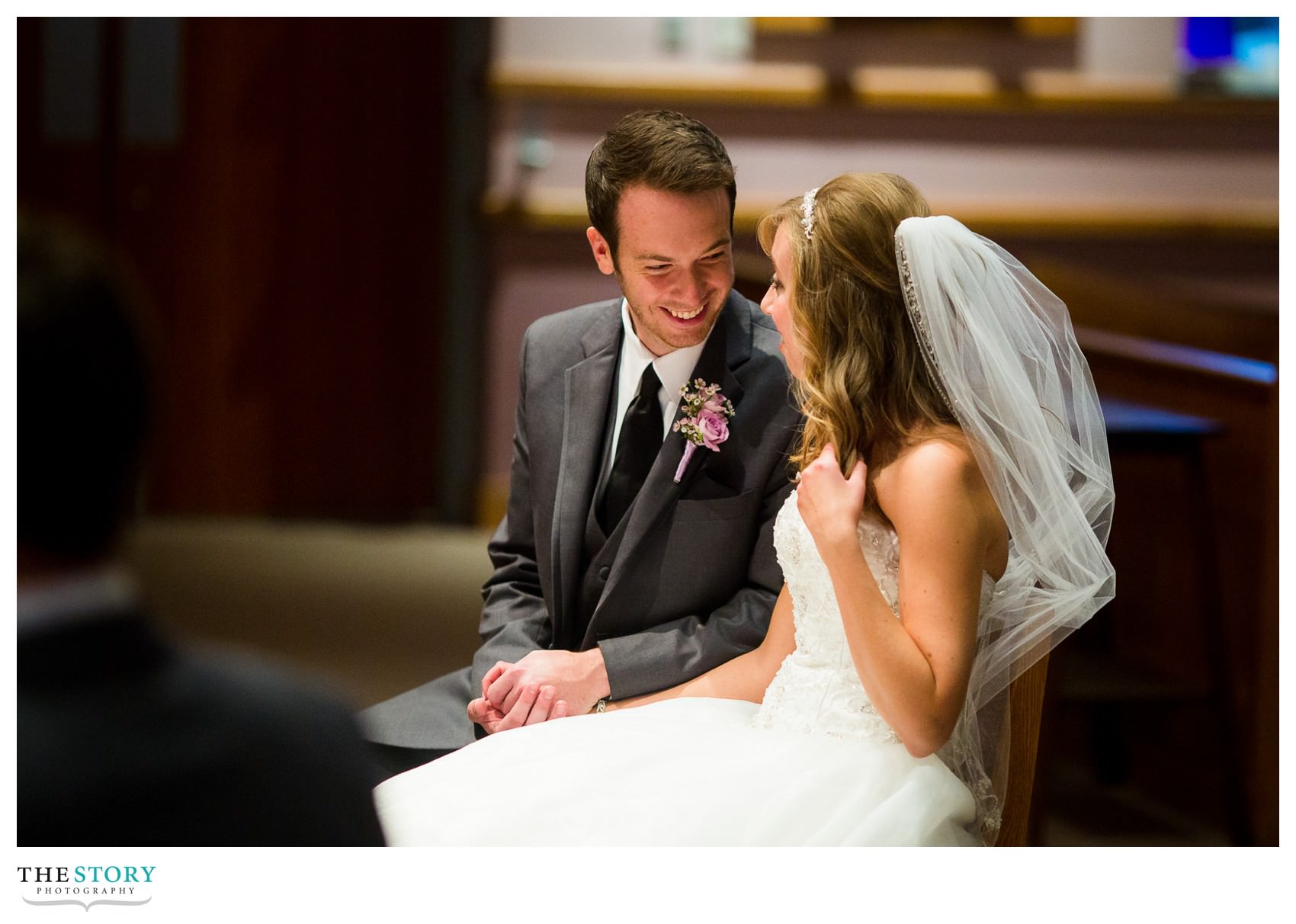 candid moment at St. Ann's Church wedding ceremony in Manlius
