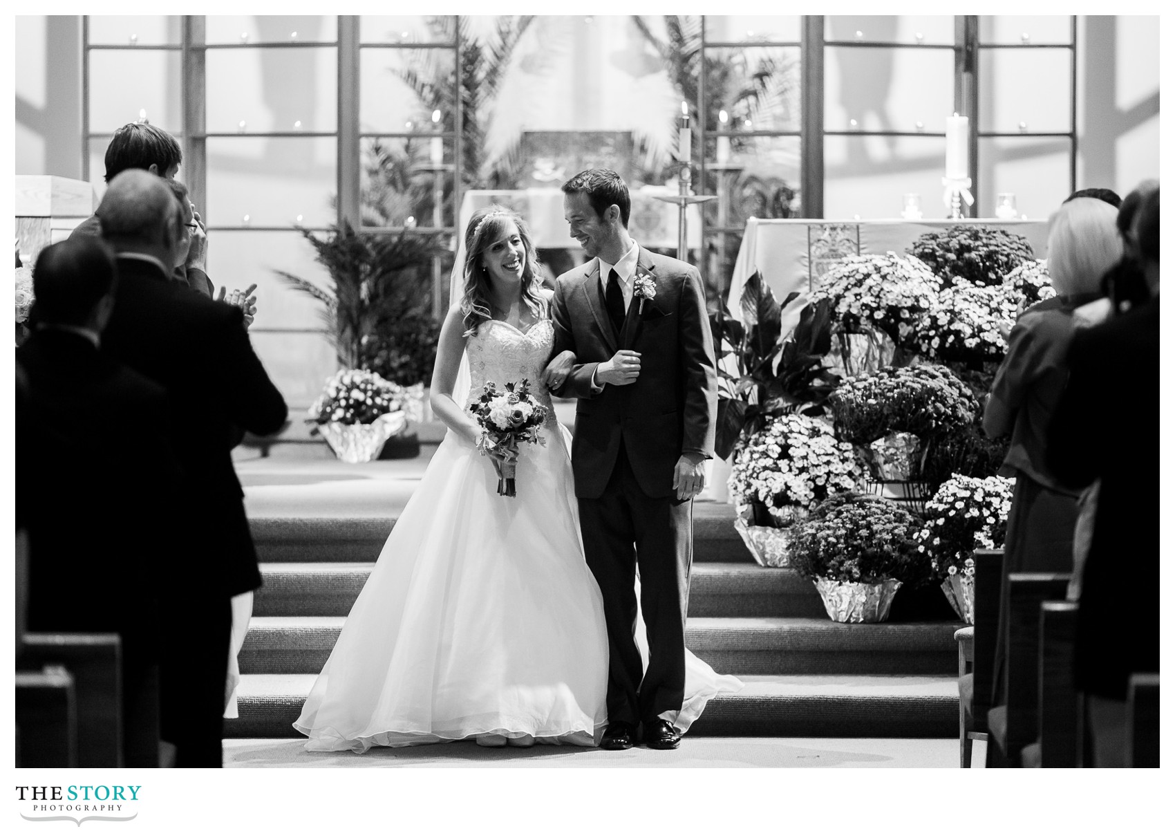 bride and groom enjoy a moment before leaving the wedding ceremony