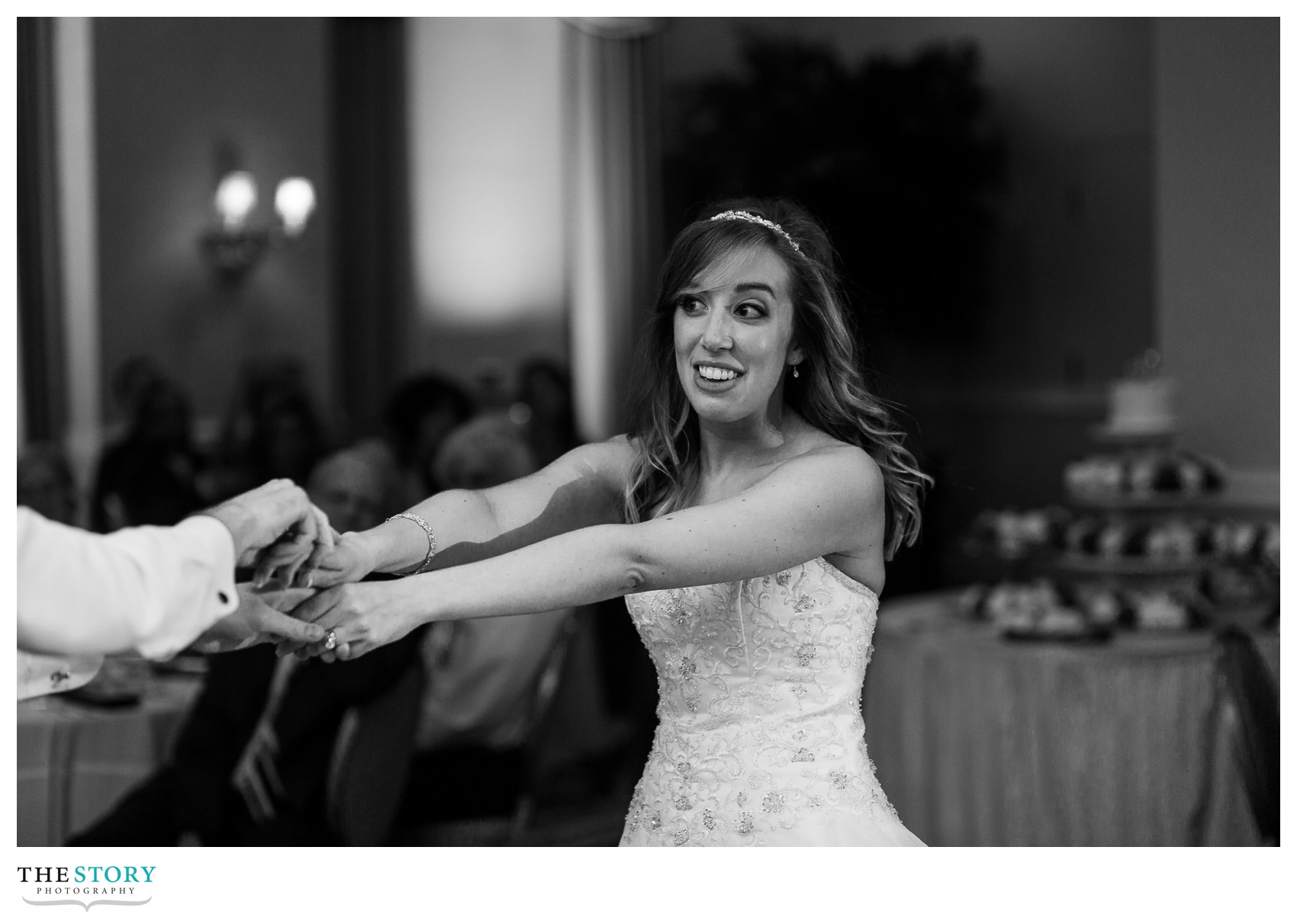 bride having fun during first dance on wedding day