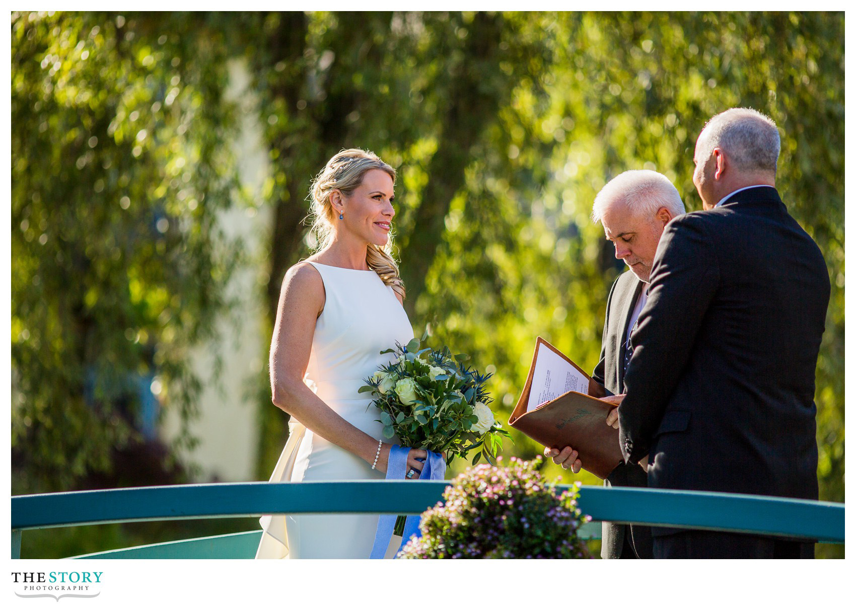 wedding photos on bridge at mirbeau spa wedding