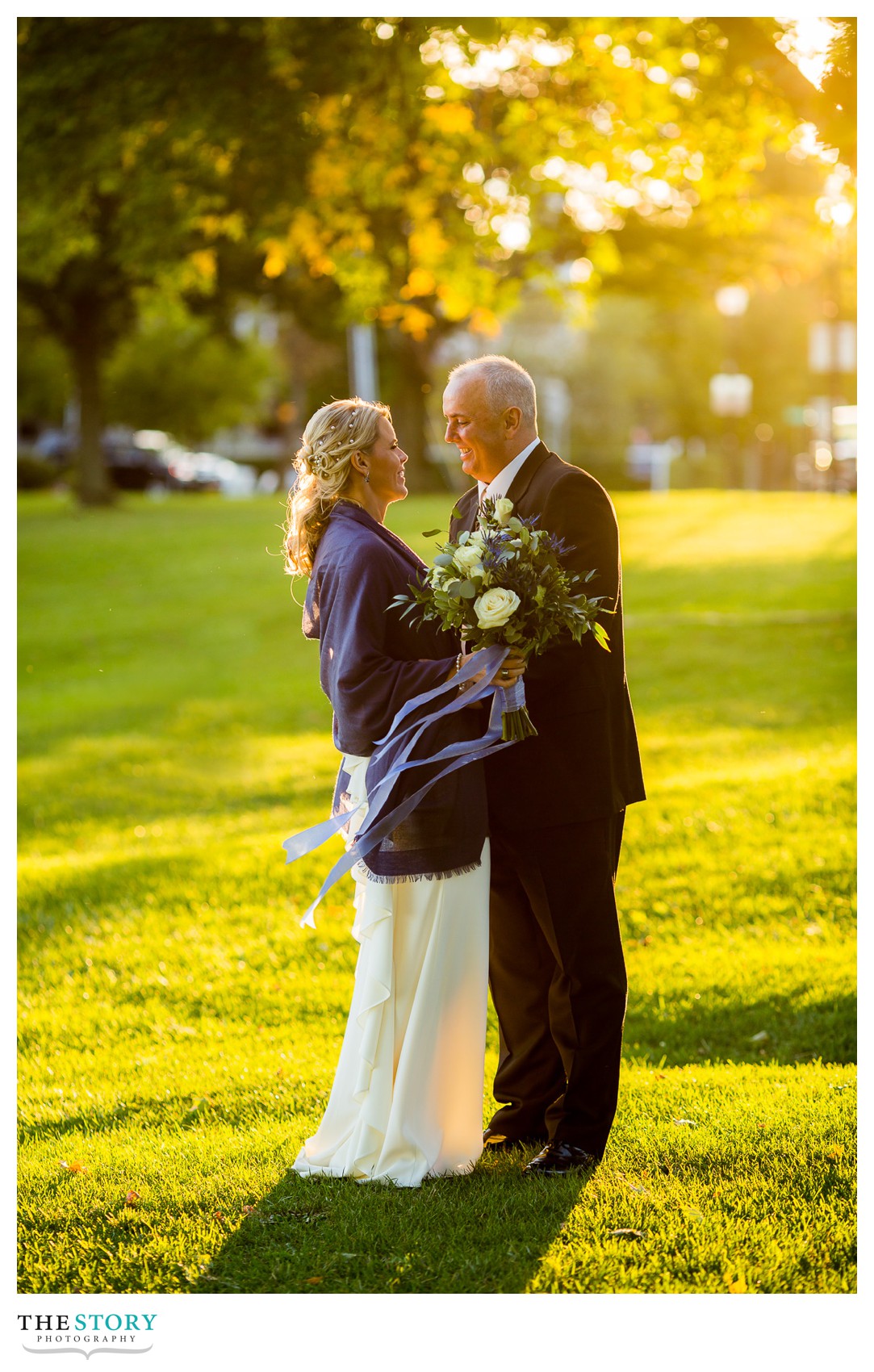 bride and groom at Shotwell Park in the village of Skaneateles