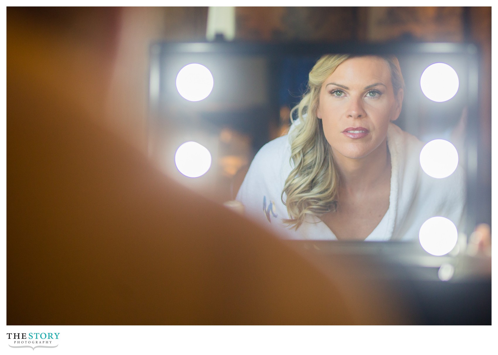 bride getting ready for outdoor wedding at mirbeau in skaneateles