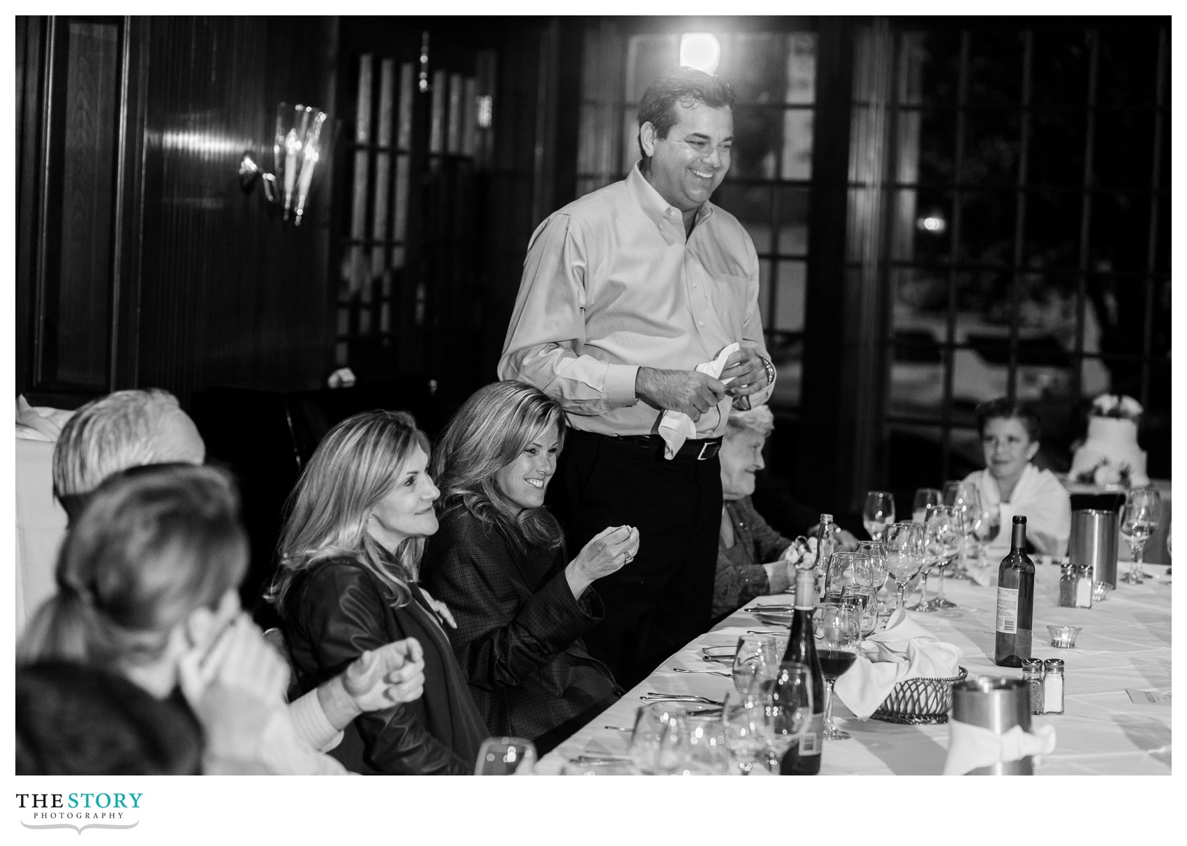 a friend of the bride and groom telling a joke at a sherwood inn wedding dinner