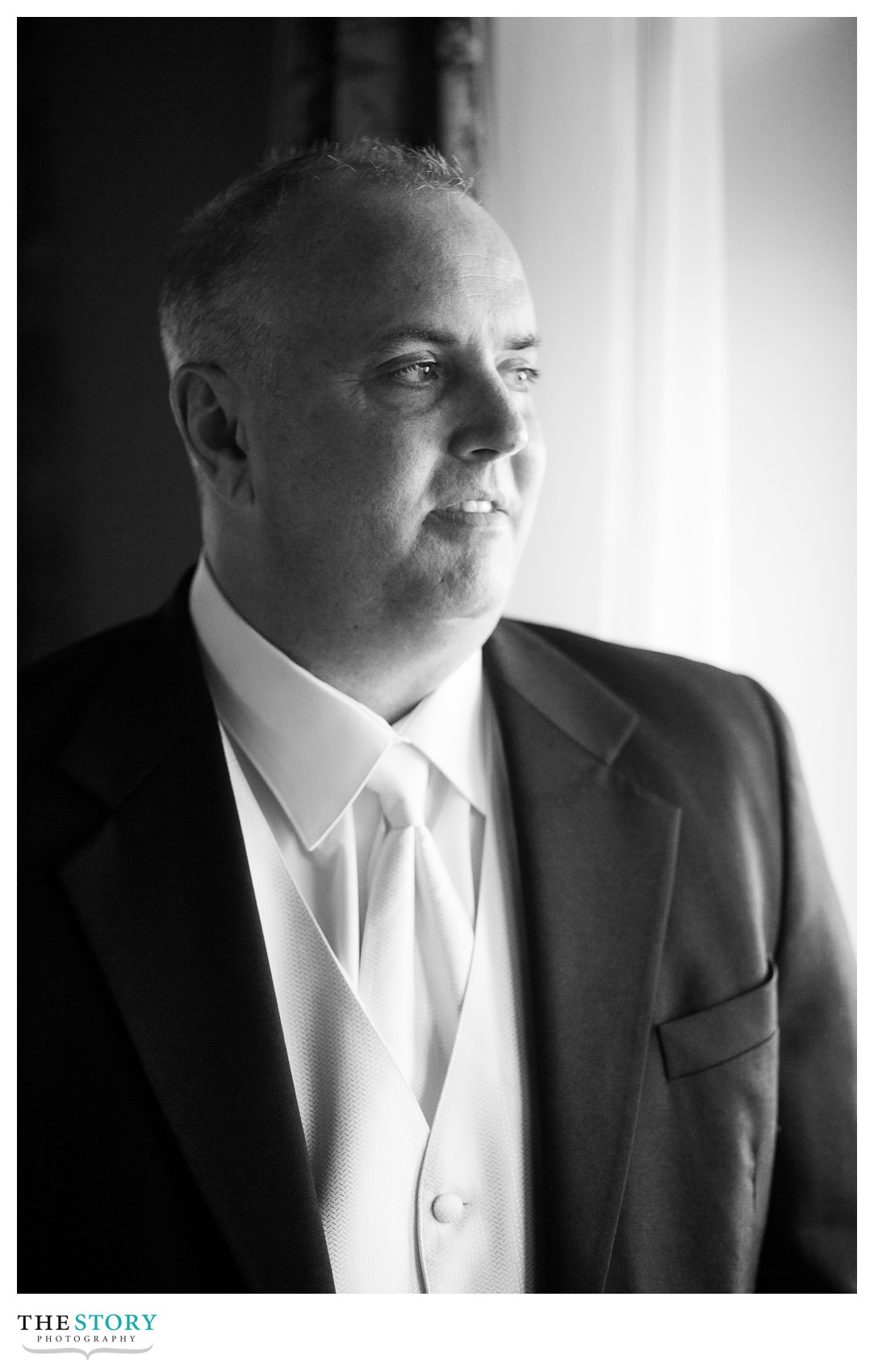 groom portrait before Mirbeau spa wedding