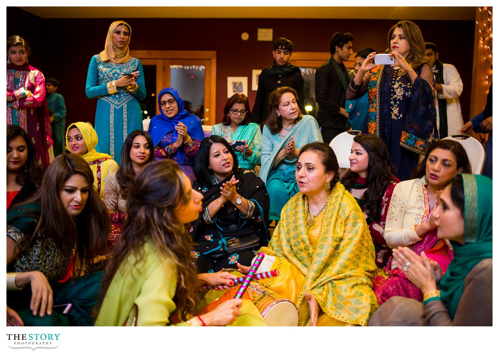 women singing at Rochester henna celebration