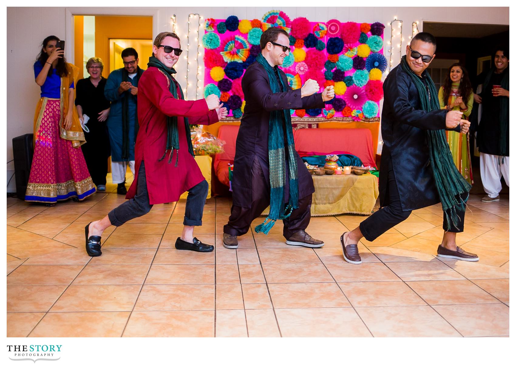 groom and friends dance at Rochester henna celebration