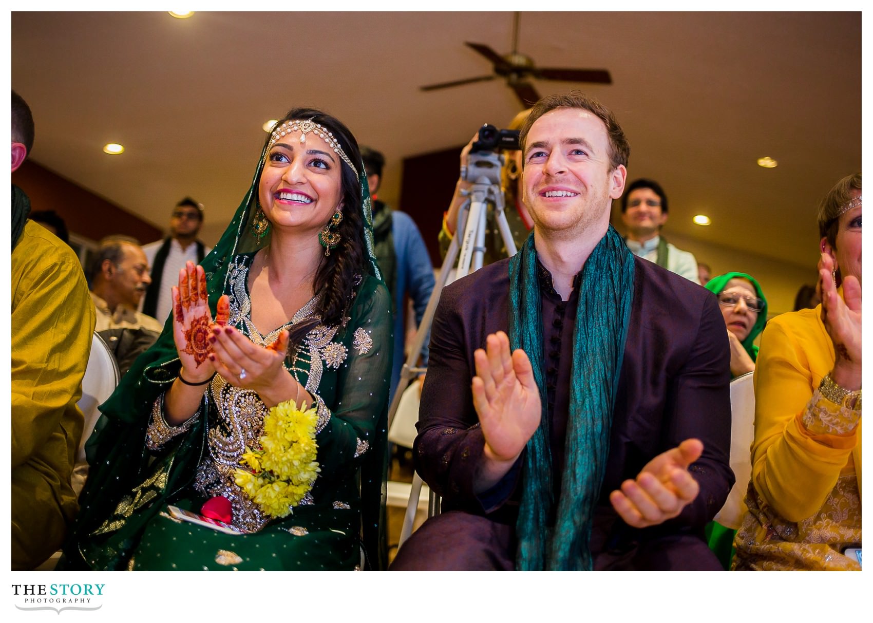 bride and groom enjoy the dances at the henna celebration