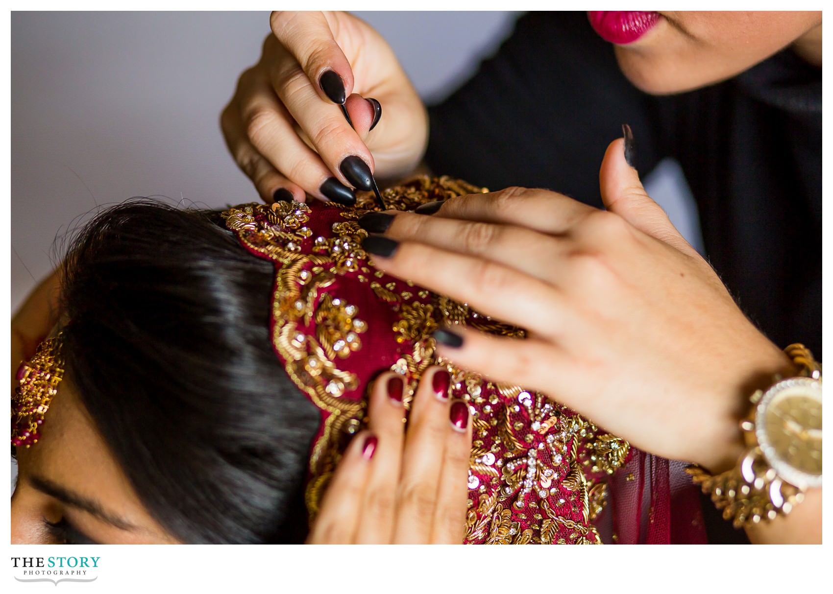 bride's veil is pinned in place 