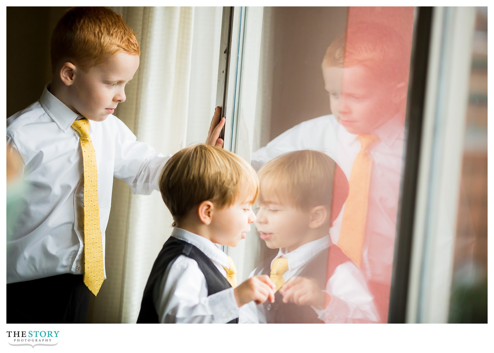 little boys looking out window at Rochester Radisson