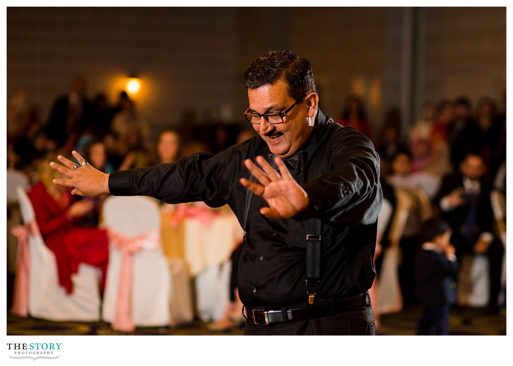 wedding guests performs dance at reception