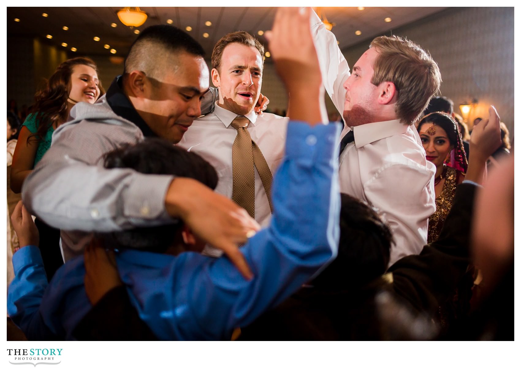 groom and friends enjoying wedding reception at Rochester Radisson