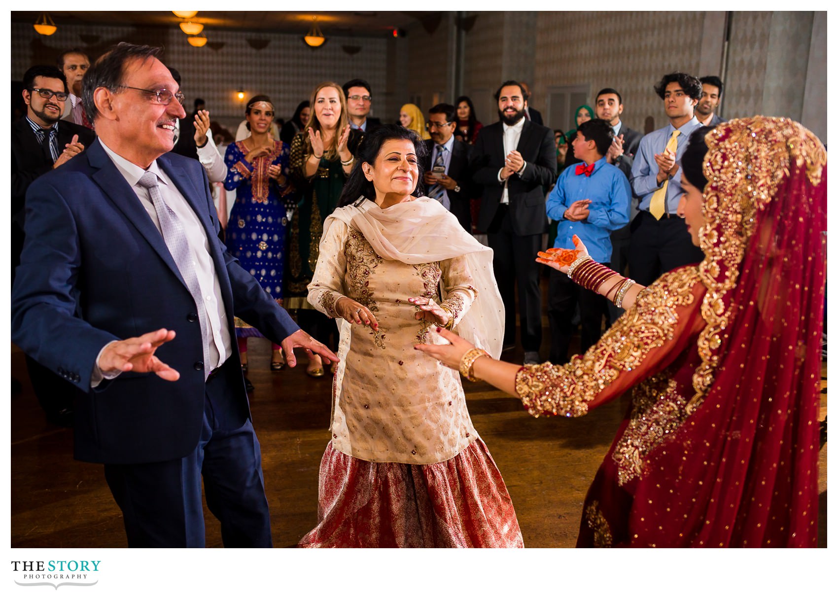 bride dancers with her parents at Rochester wedding reception