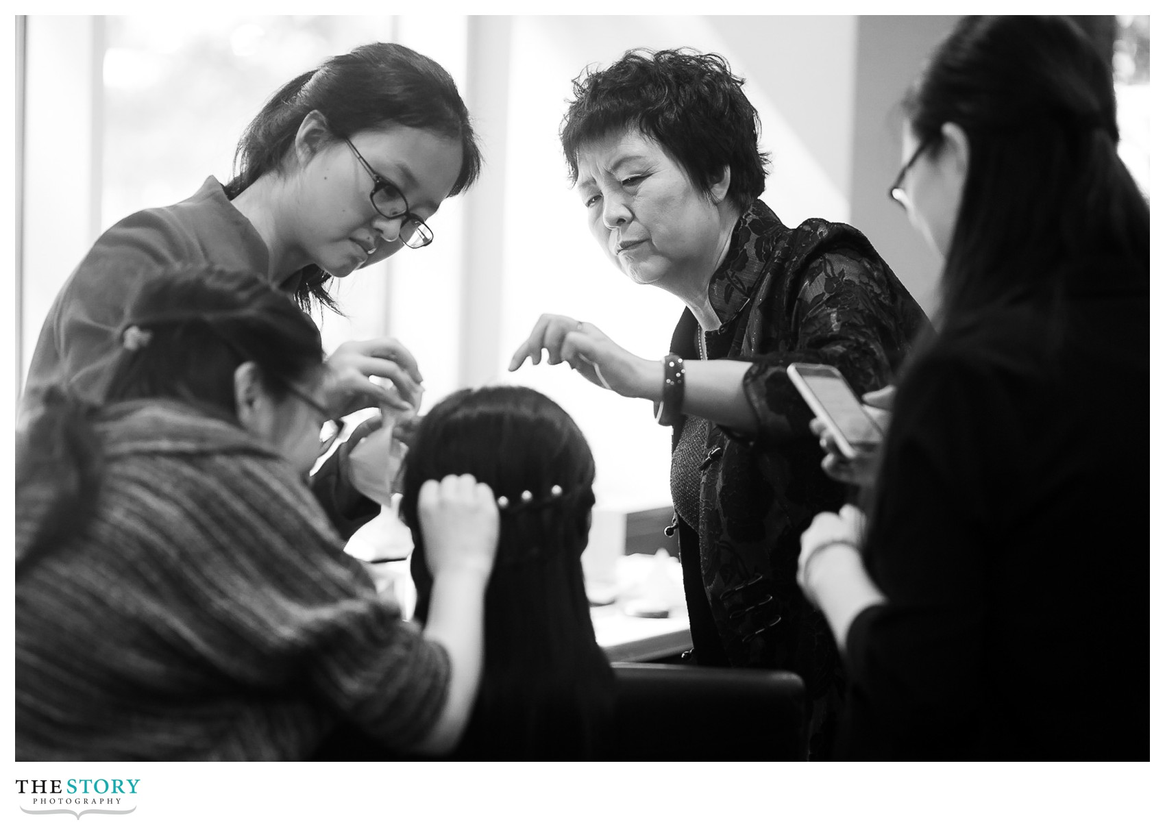 everyone helping the bride get ready at Cornell University wedding