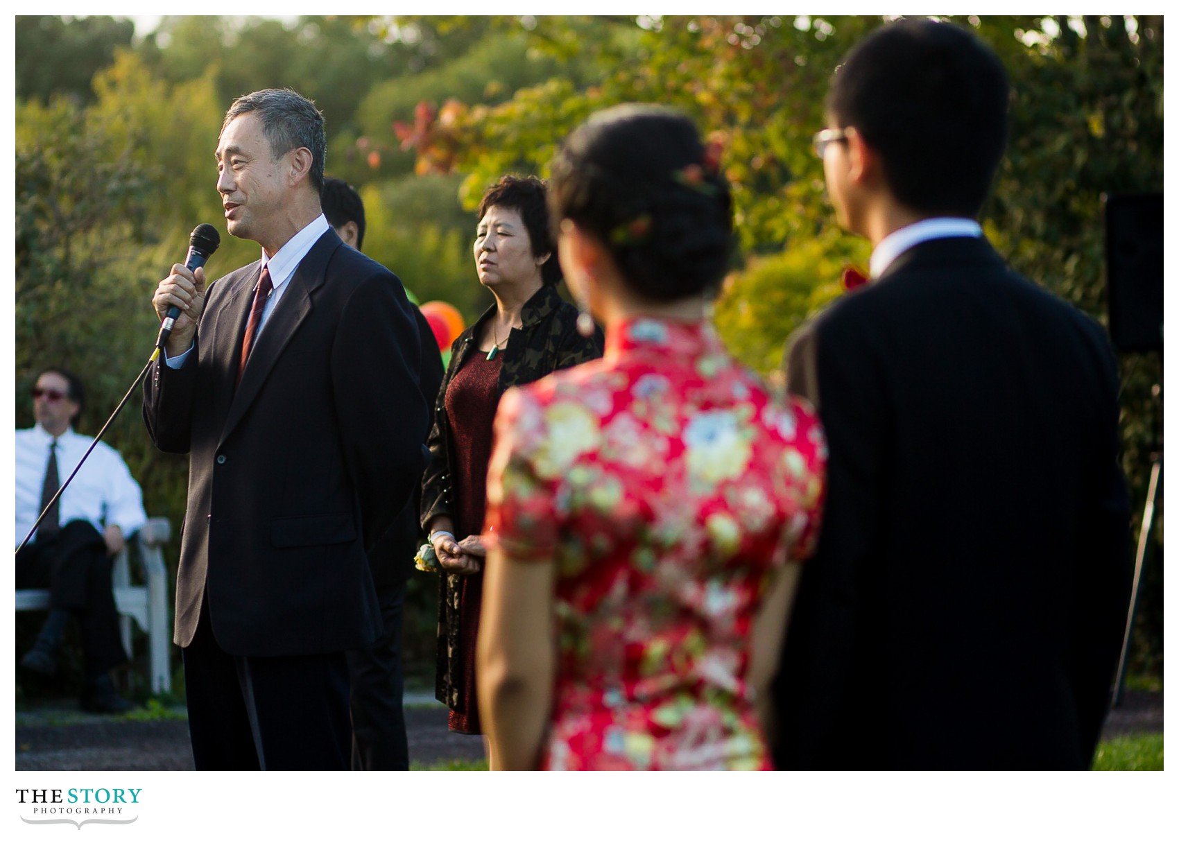 groom's father gives wedding speech at Cornell's F.R. Newman Arboretum