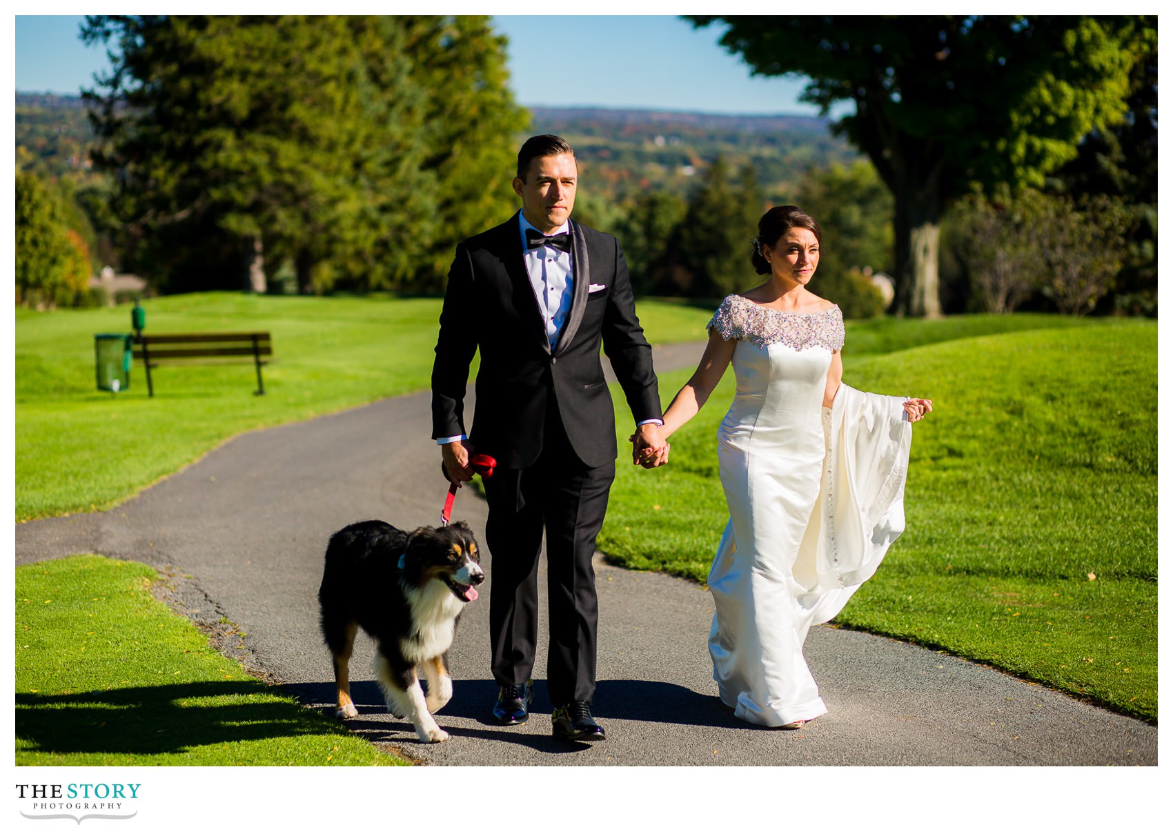 bride and groom walking at onondaga country club wedding